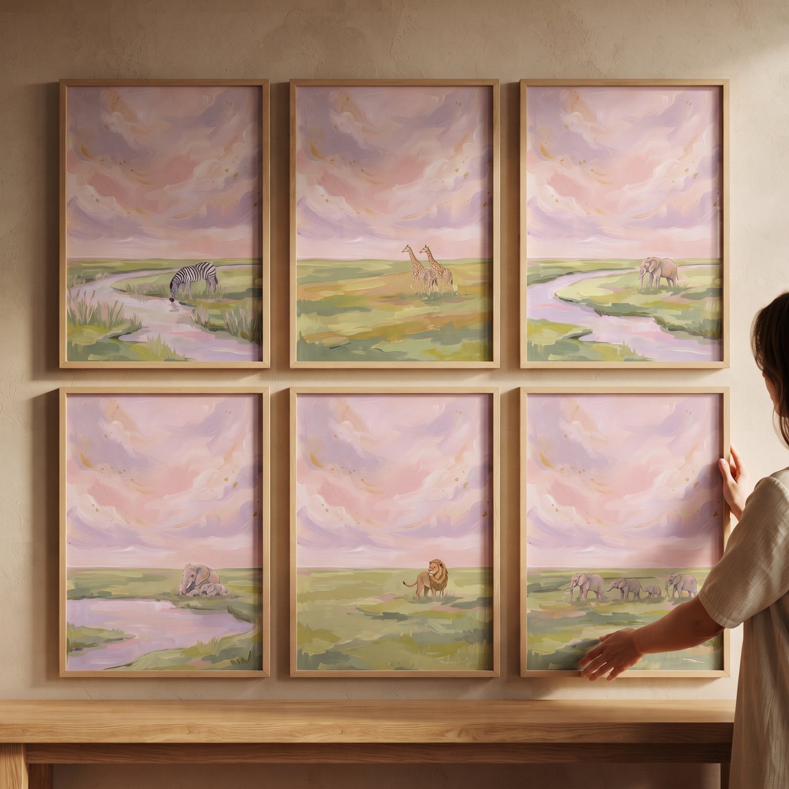 Gold shimmer safari animals wall art set of 6 features giraffes, zebras, and elephants in soft pastel sunset landscapes.