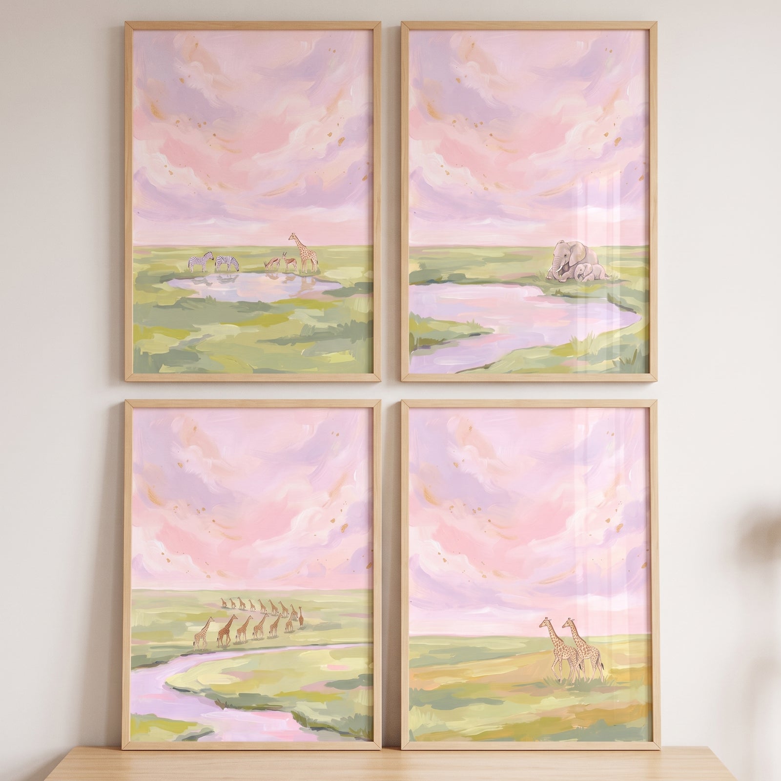 Gold shimmering safari animals wall art set of 4 features giraffes, elephants, and zebras in a pastel savanna scene.