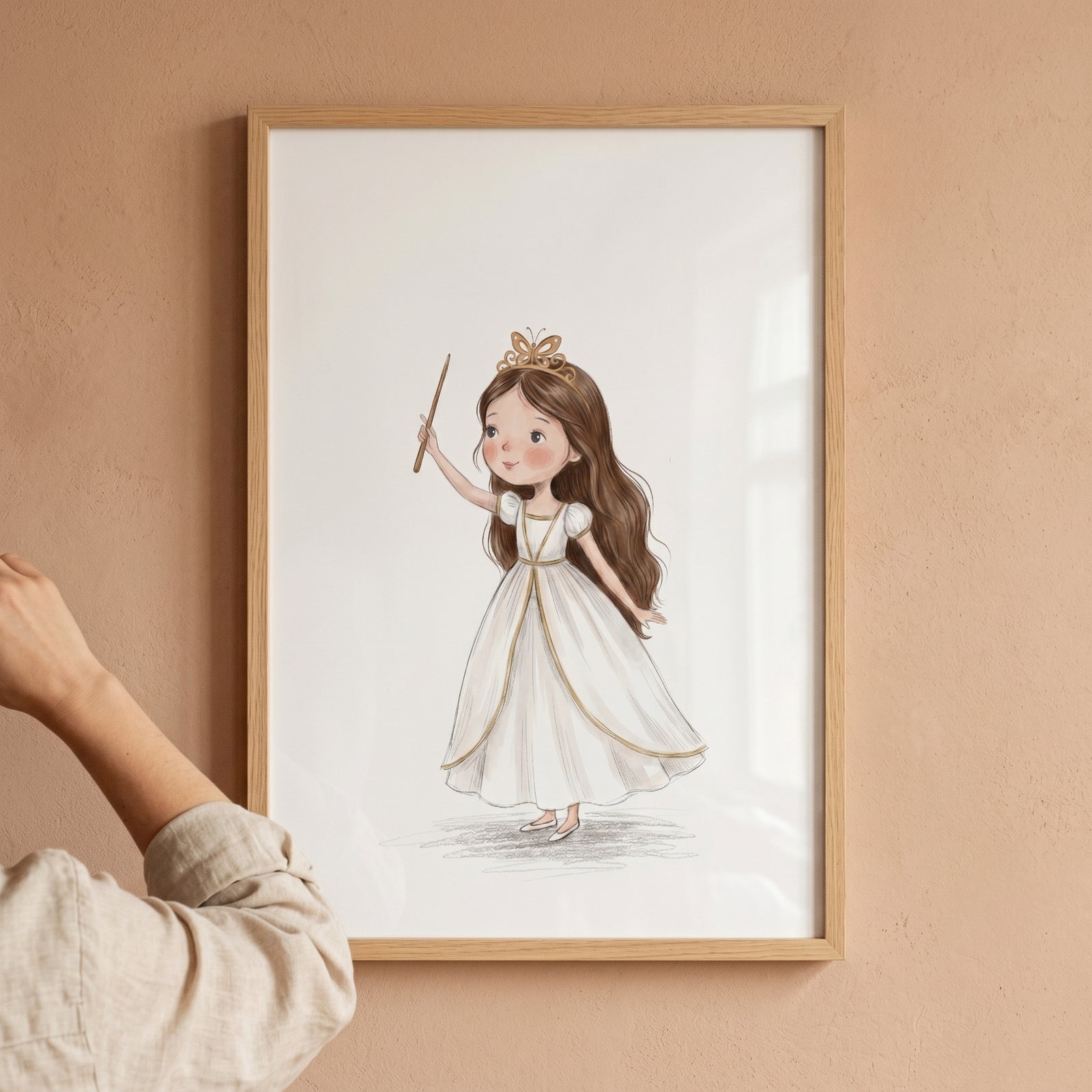 Gold wand little girl wall art featuring a framed illustration of a girl in a white dress and butterfly crown.