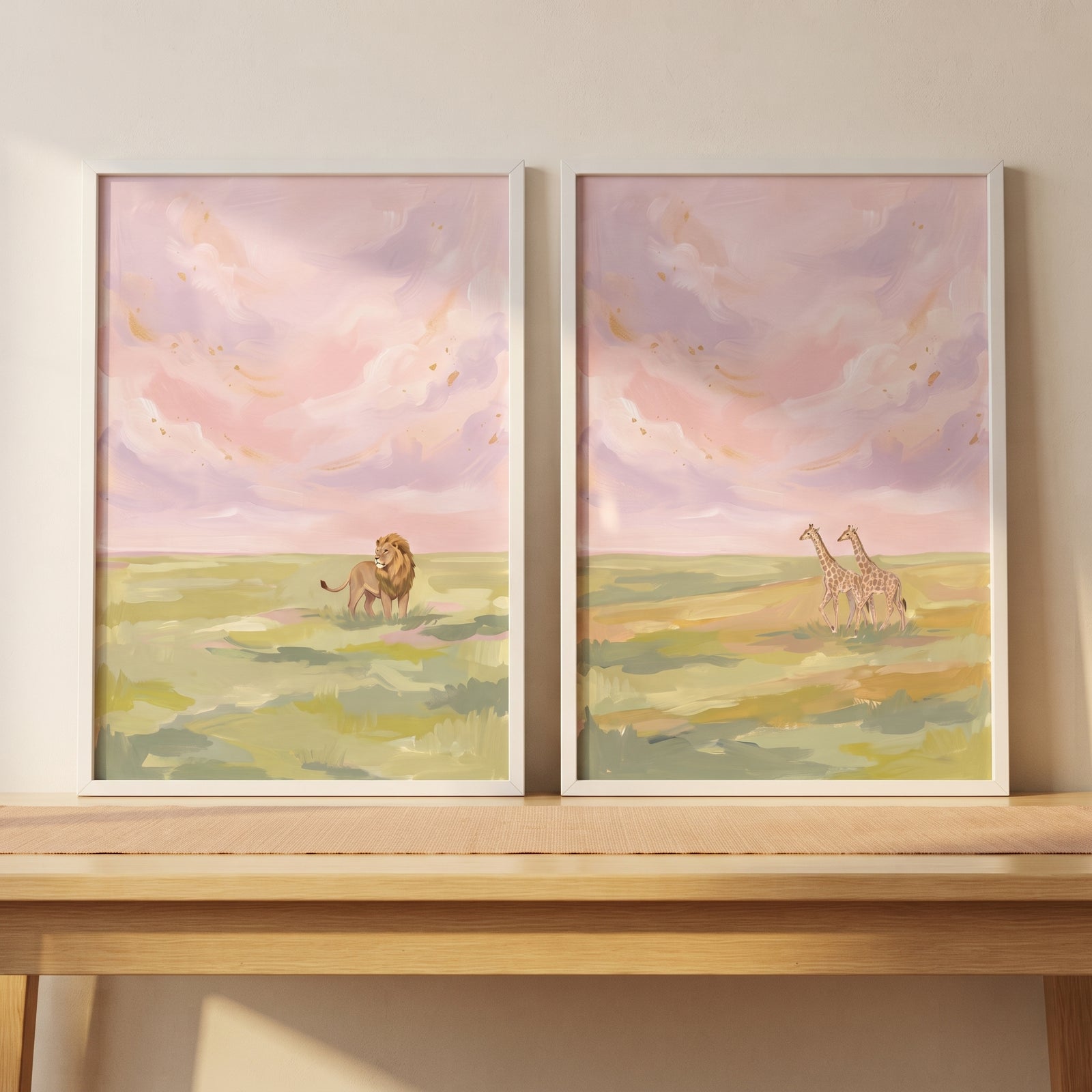 A lion and giraffes stand in grassy fields under a soft pink sky in this golden sky savanna animals wall art set of 2.