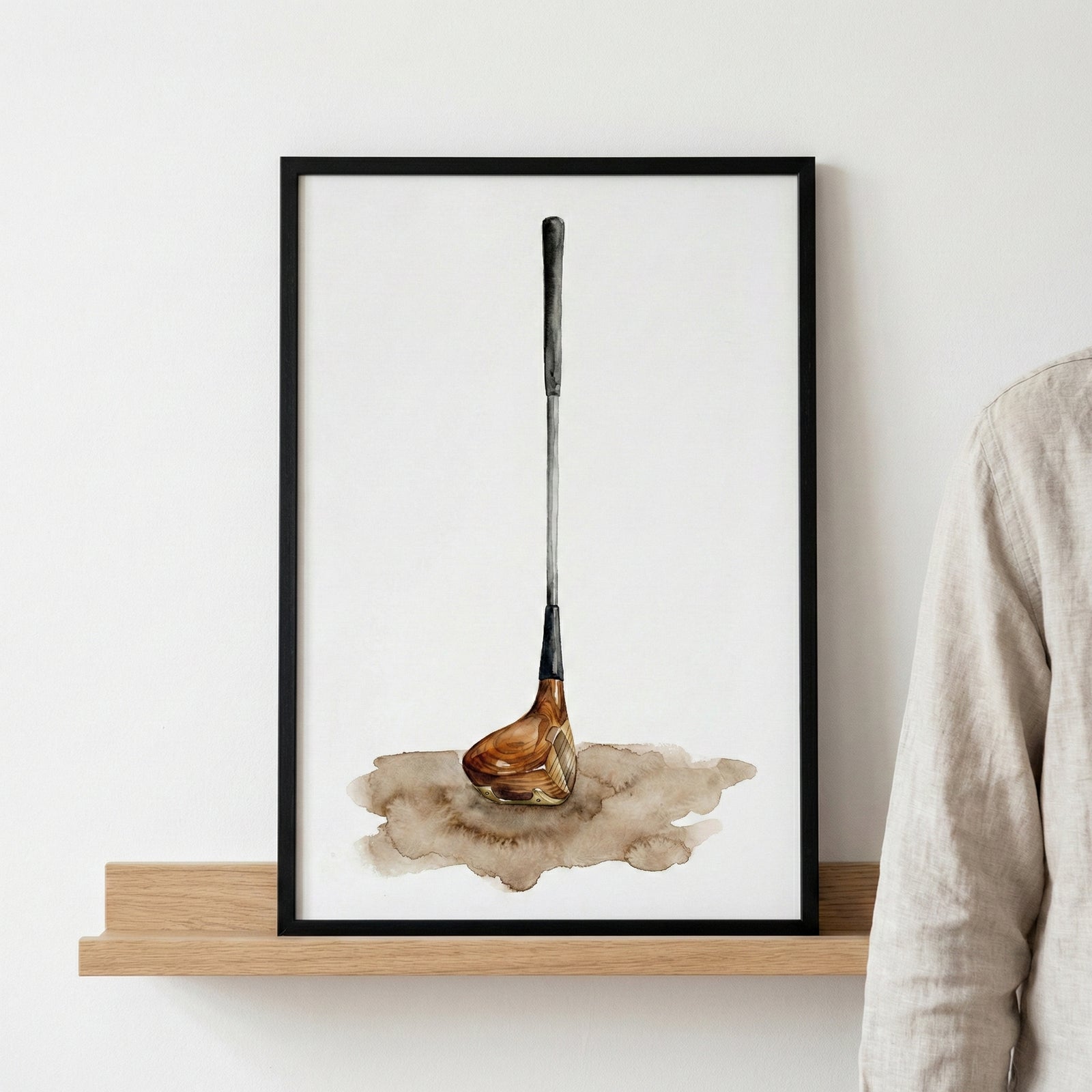 Minimalist watercolor painting of a single vintage golf club with a wooden head, standing upright on a light background with a splash of earthy tones beneath it. Suitable for golf enthusiasts of all ages.