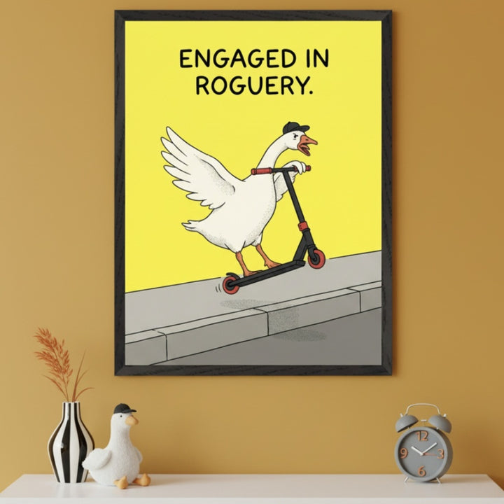Modern room with a mustard yellow wall and a white shelf. A framed cartoon print of a goose in a black cap riding a scooter with text "ENGAGED IN ROGUERY" hangs above the shelf. A striped vase, goose plush, and alarm clock are on the shelf.