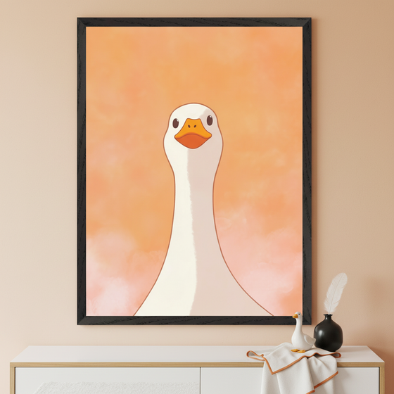 Modern room with a white dresser. A large framed cartoon print of a white goose looking directly forward, on an orange watercolor background, hangs centered above the dresser. A small goose figurine, black vase with a feather, and a folded towel are on the dresser.