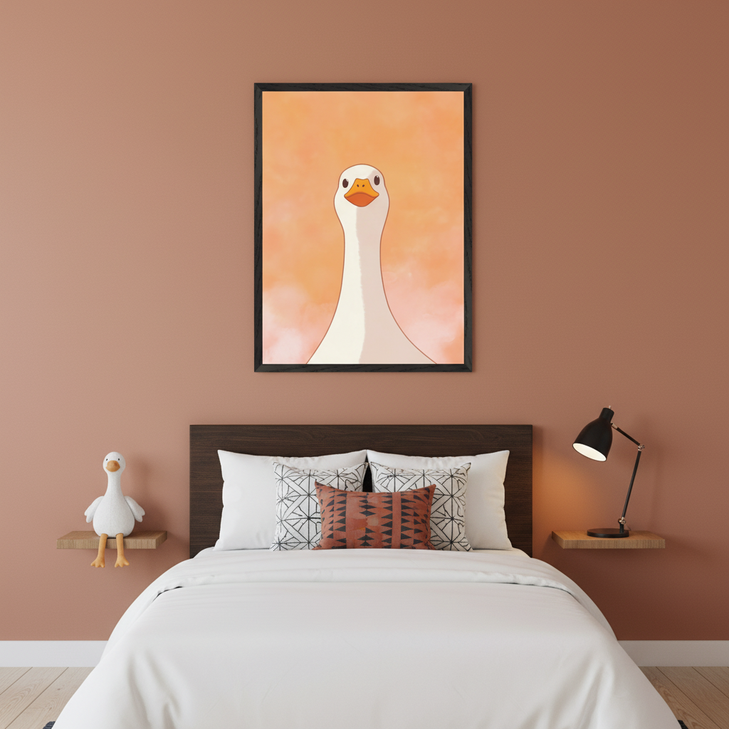 Modern bedroom with a terracotta wall. A large framed illustration of a white goose with an orange beak on a peachy background hangs centered above a bed with a dark wooden headboard. A goose plushie is on a shelf to the left.