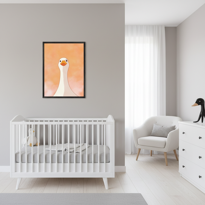 Modern nursery with a white crib and gray bedding. A framed cartoon print of a white goose with an orange background hangs above the crib. A white armchair and dresser are on the right.