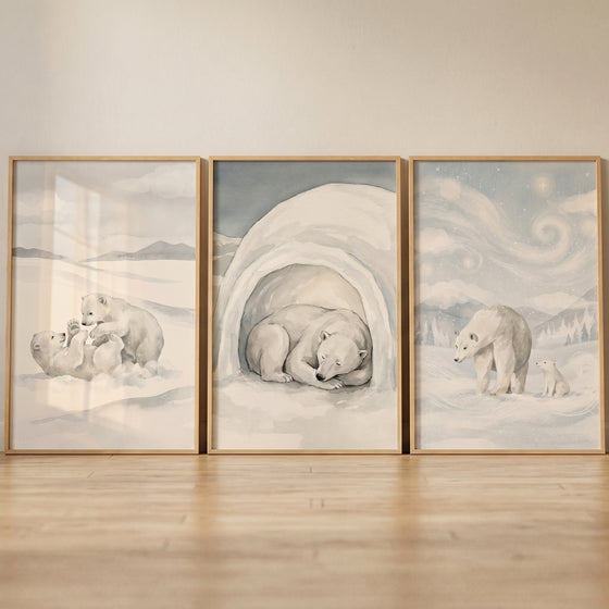 Grey watercolor polar bear wall art set of 3 showing bears playing, resting in a cave, and walking under a swirling sky.