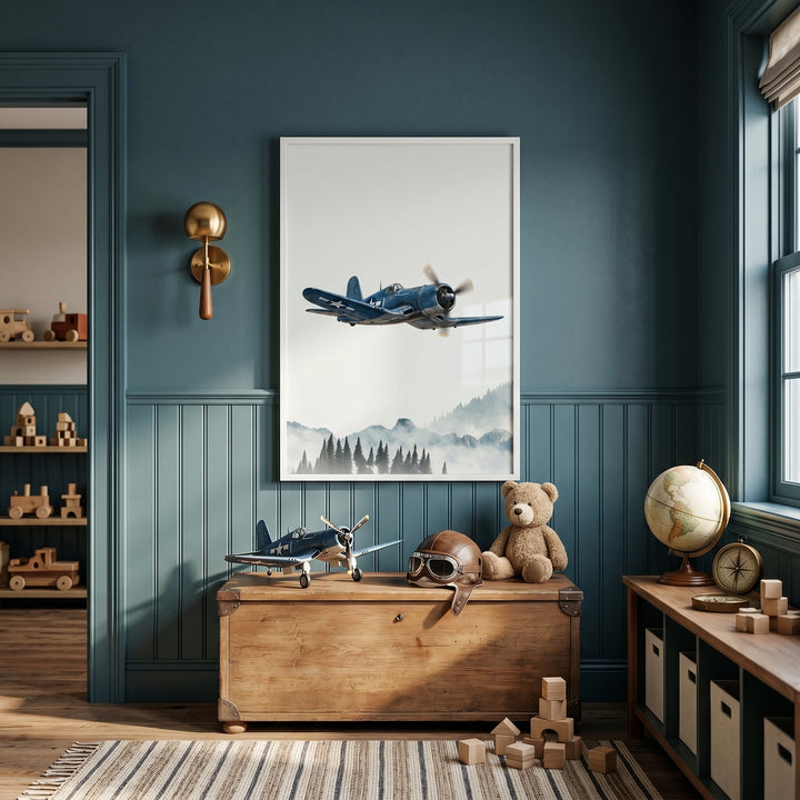 Gull wing blue airplane wall art hangs in a teal room above a wooden chest with an aviator helmet and teddy bear.