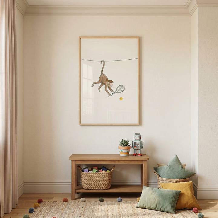 Hanging tail tennis monkey wall art above a wooden bench in a nursery with a toy robot and soft pillows.