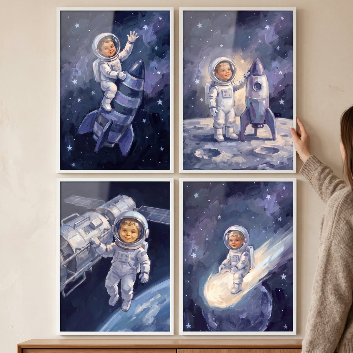 Happy exploring baby astronaut wall art set of 4 shows a child in space suits among stars, rockets, and planets.