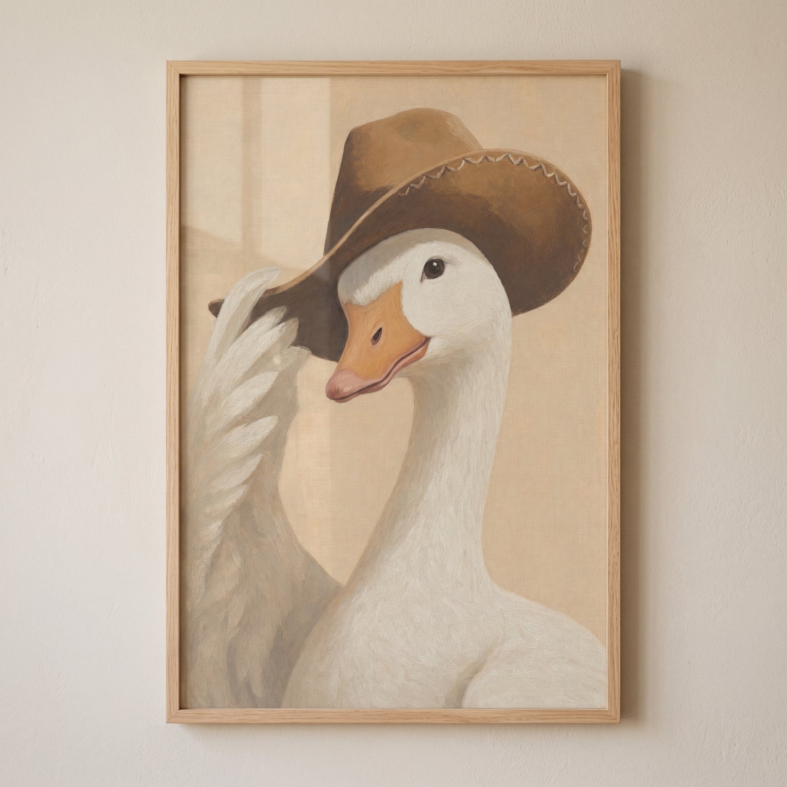 Hat tipping rustic goose wall art features a white goose tipping its brown cowboy hat inside a light wood frame.