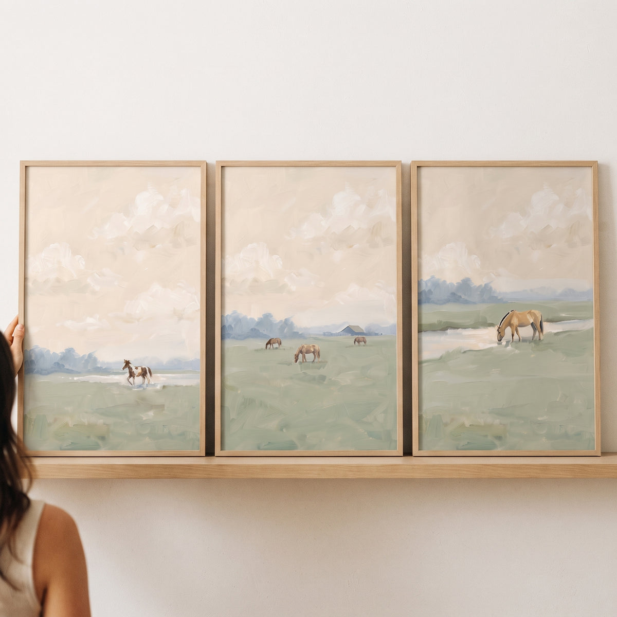 Horses graze in muted green fields under a soft sky in this hazy pasture landscape horse wall art set of 3.