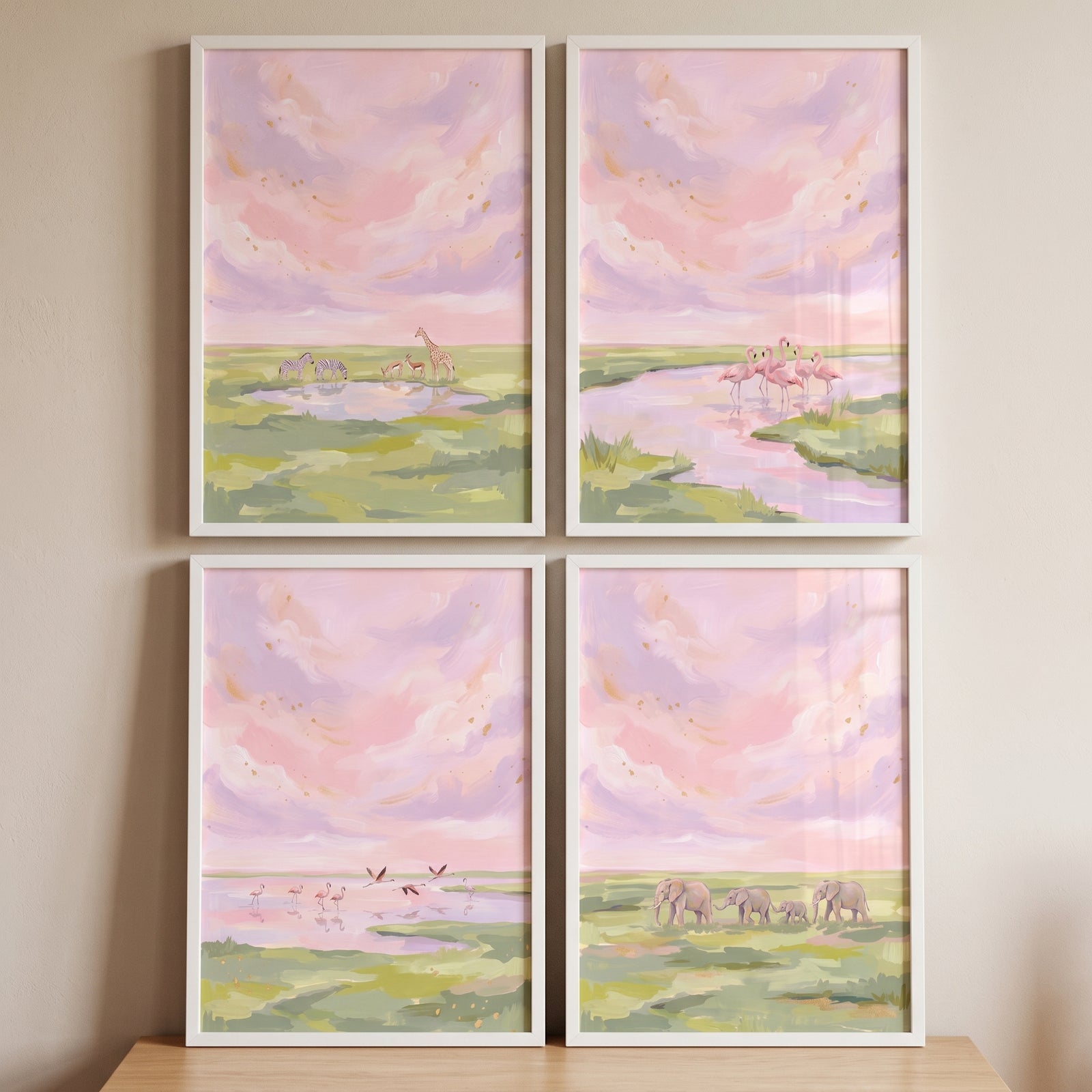 Hazy rose safari animals wall art set of 4 depicts elephants, flamingos, and giraffes in soft, pastel landscapes.
