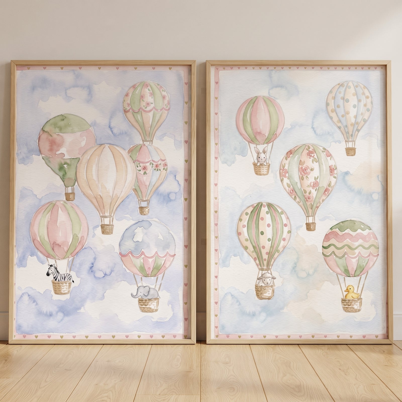 Heart hot air balloon wall art set of 2 features pastel watercolor balloons with cute animals in a soft sky.
