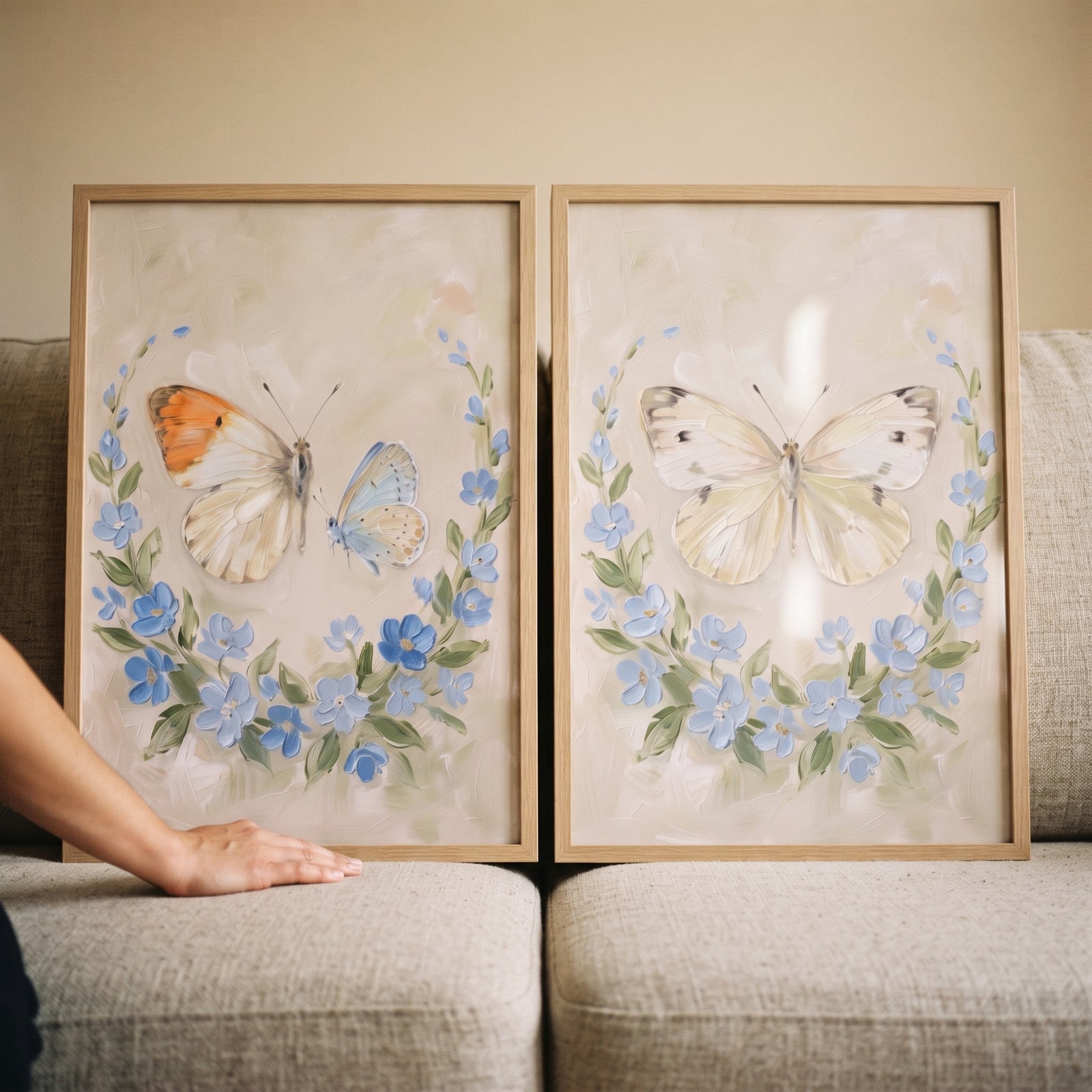 Heavy impasto blue butterfly wall art set of 2 featuring textured insects and floral wreaths in light wood frames.