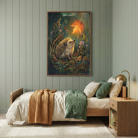 A cozy bedroom features pale green vertical wood-paneled walls and a wooden bed frame. The bed is dressed with light cream linens, a chunky mustard yellow knit throw, and a folded dark green duvet at the foot. Centered above the bed hangs a large, vertical framed artwork depicting a small, detailed hedgehog in a forest looking up at a single, glowing orange leaf suspended in the air. To the right of the bed is a simple wooden nightstand with a brass-colored dome lamp.