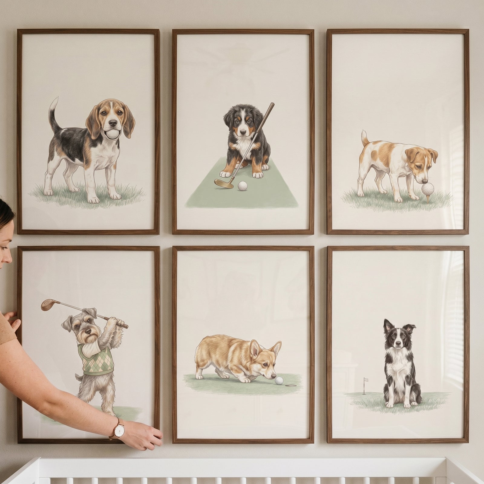 A hand adjusts the heritage neutral golfing dogs wall art set of 6 featuring various dog breeds in golf themes.