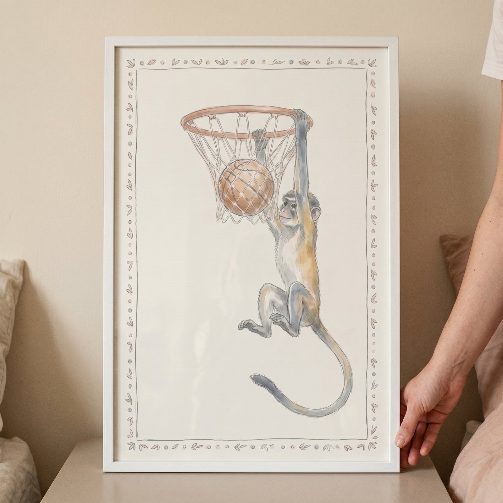 Hoop hanging basketball monkey artwork shows a watercolor animal swinging from a rim with a ball in the net.
