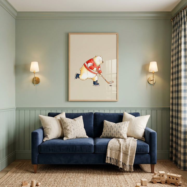 Ice hockey bear wall art hangs above a navy sofa in a green room with wall sconces and a wooden toy train on the rug.