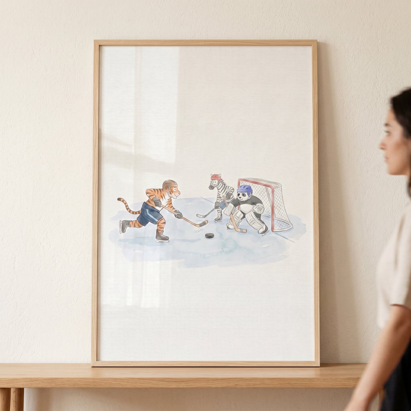 Framed ice hockey goalie animals wall art features a tiger, zebra, and panda playing a hockey game on the ice.