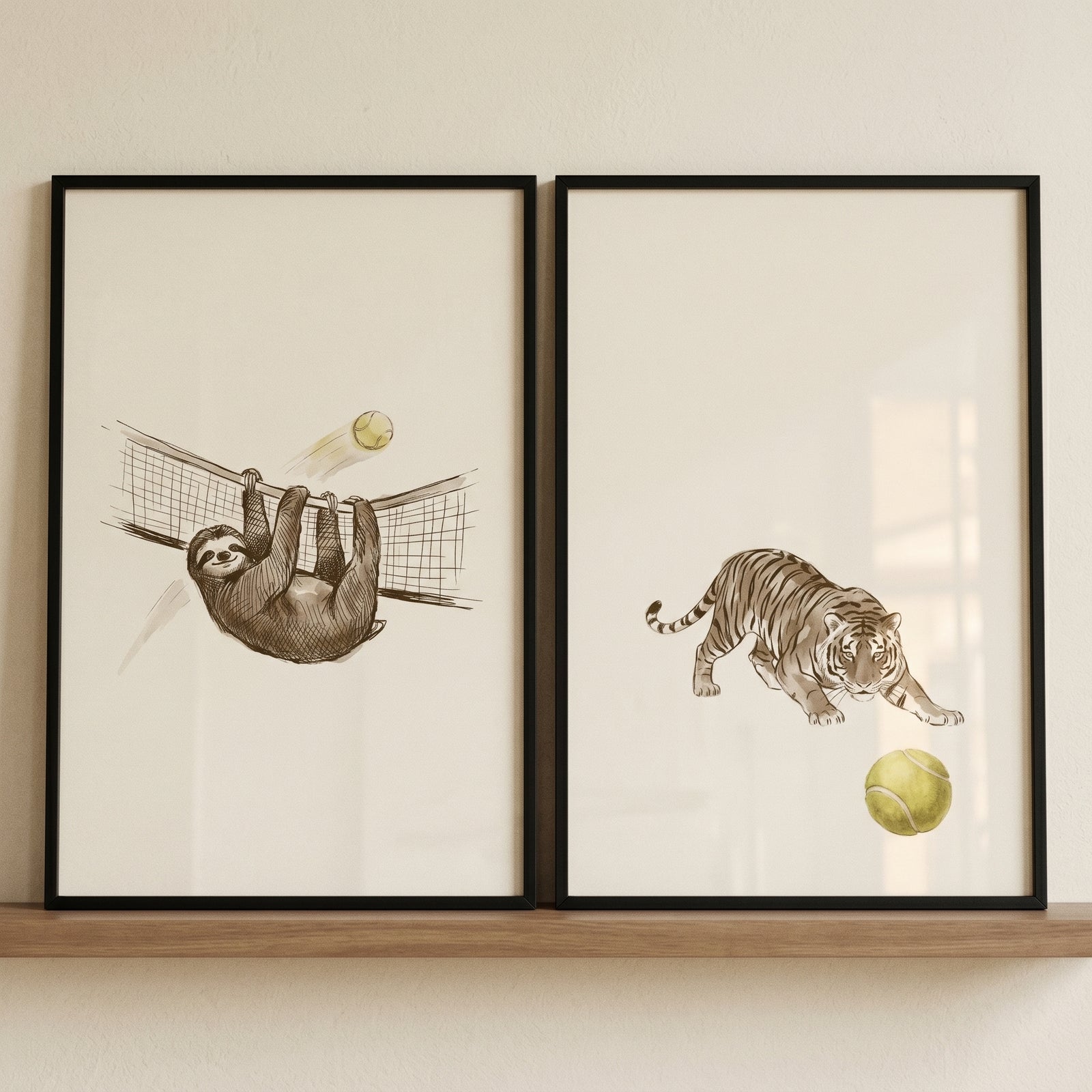 Illustrated sage tennis animals wall art set of 2 featuring a sloth on a tennis net and a tiger pouncing at a ball.