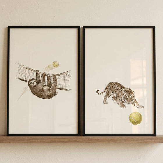 Illustrated sage tennis animals wall art set of 2 featuring a sloth on a tennis net and a tiger pouncing at a ball.