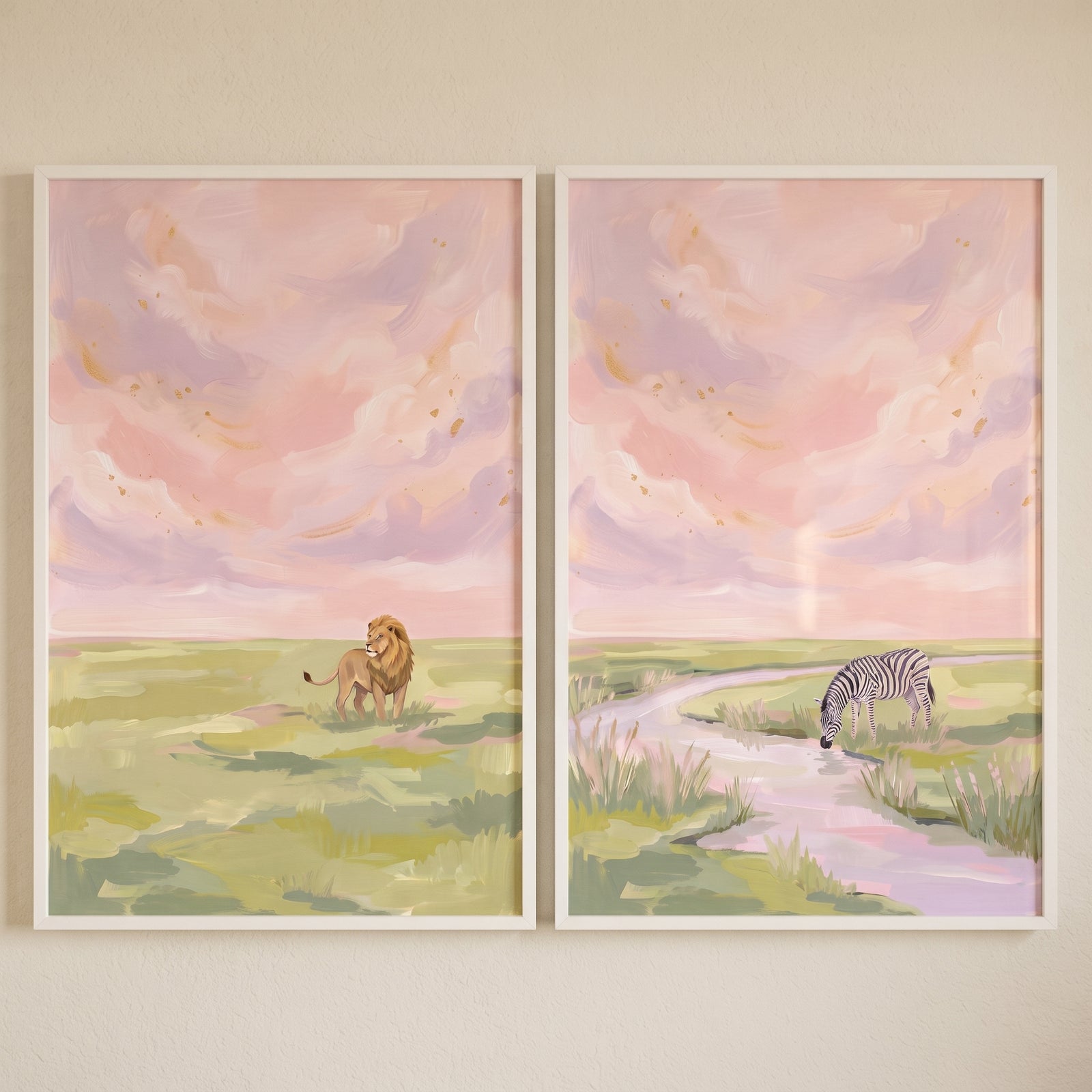 Impasto blush savanna animals wall art set of 2 shows a lion and a zebra by a stream under a soft pink textured sky.