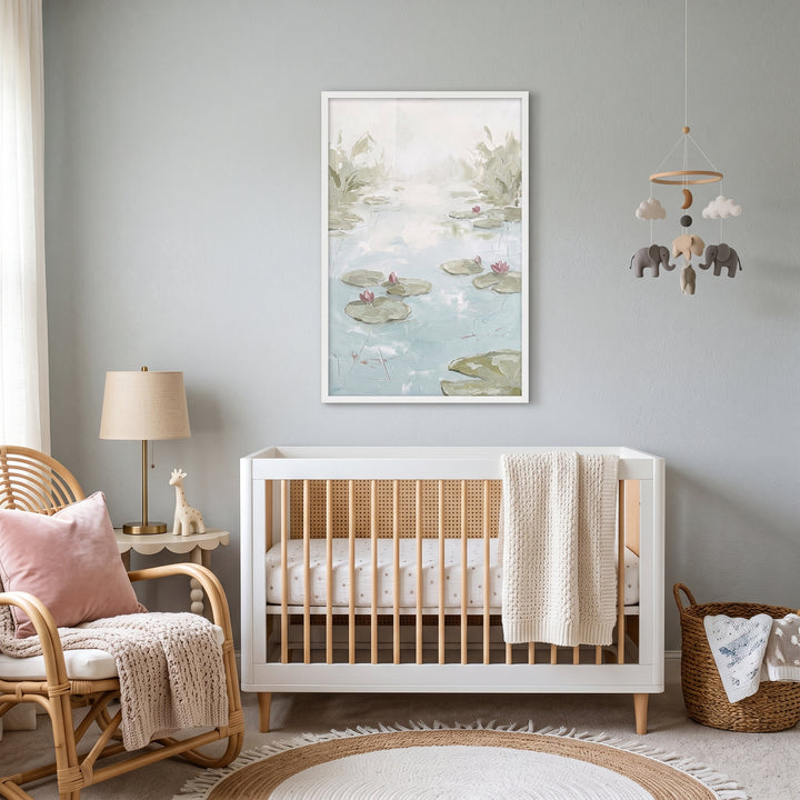 Serene nursery features a white crib, rattan chair, and impasto pink water lily pond wall art.