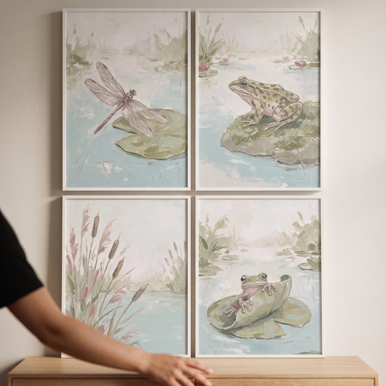 Impasto textured pond artwork set of 4 featuring frogs, a dragonfly, and reeds in muted pastel colors and white frames.