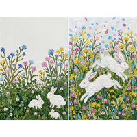 This two-panel artwork features white rabbits in vibrant wildflower meadows. The left panel shows a large rabbit and two smaller ones nestled among green clover and tall, colorful blooms against a stark white sky. On the right, two rabbits leap through a dense field of yellow, pink, and blue flowers under a sky filled with falling petals. The entire piece is created with a thick impasto technique, using textured, visible strokes to bring the lively floral scenes to life.