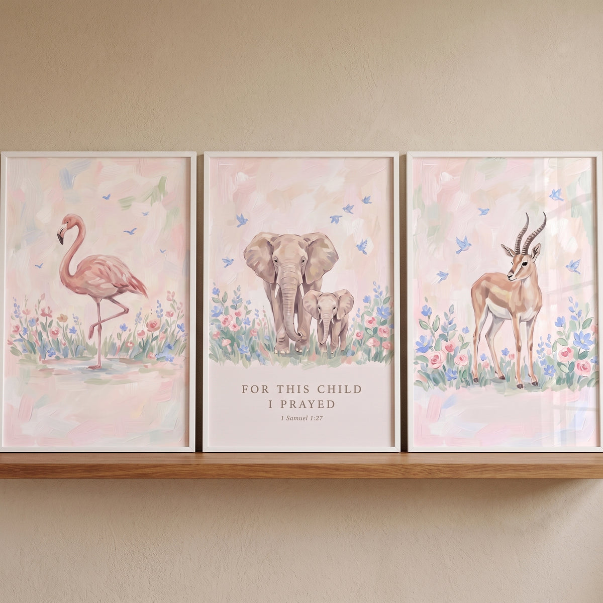 Impressionist blush pink safari animals artwork set of 3 featuring a flamingo, elephants, and a gazelle in pastel flowers.