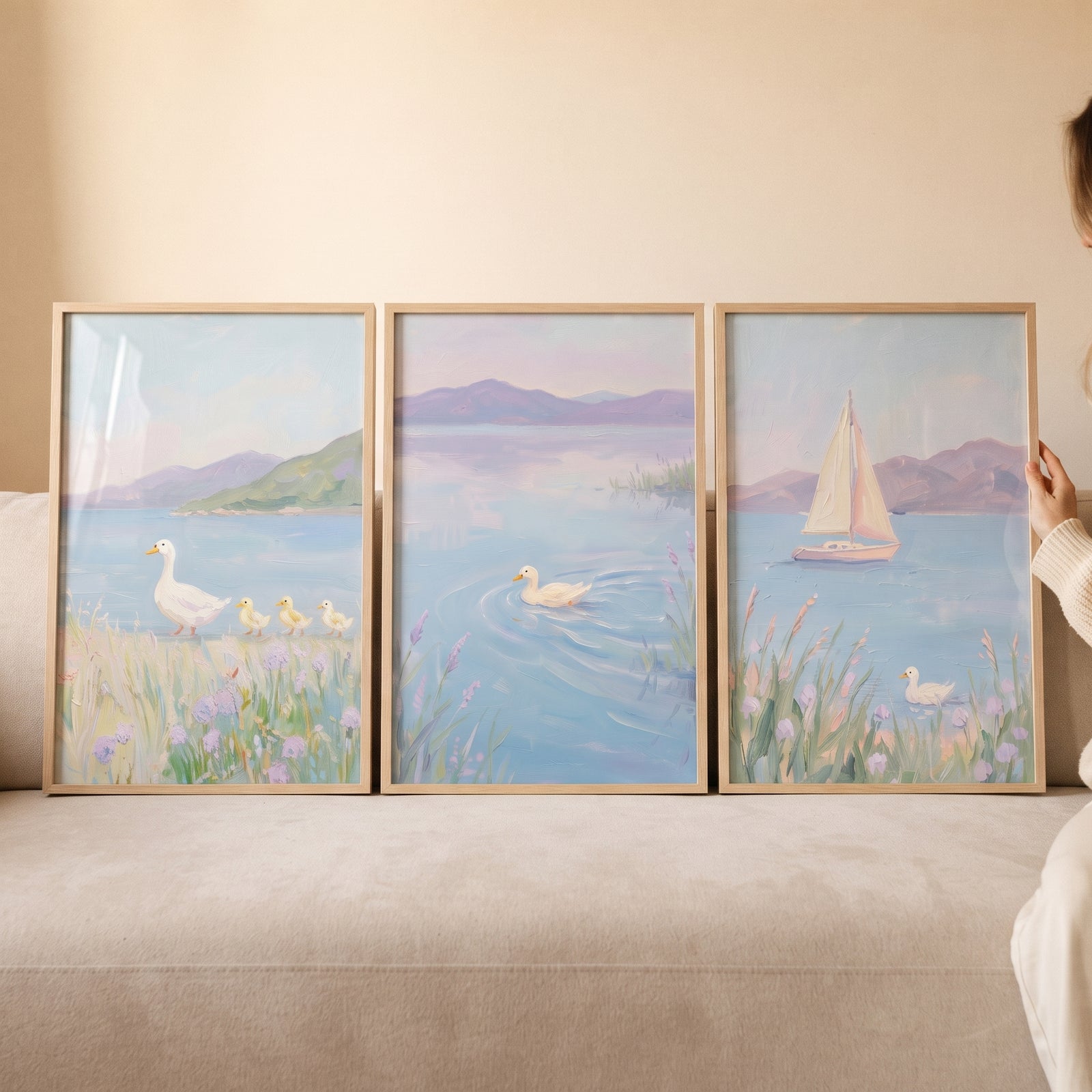 Impressionist lilac white duck wall art set of 3 with ducks and a sailboat on a serene lake with lavender hills.