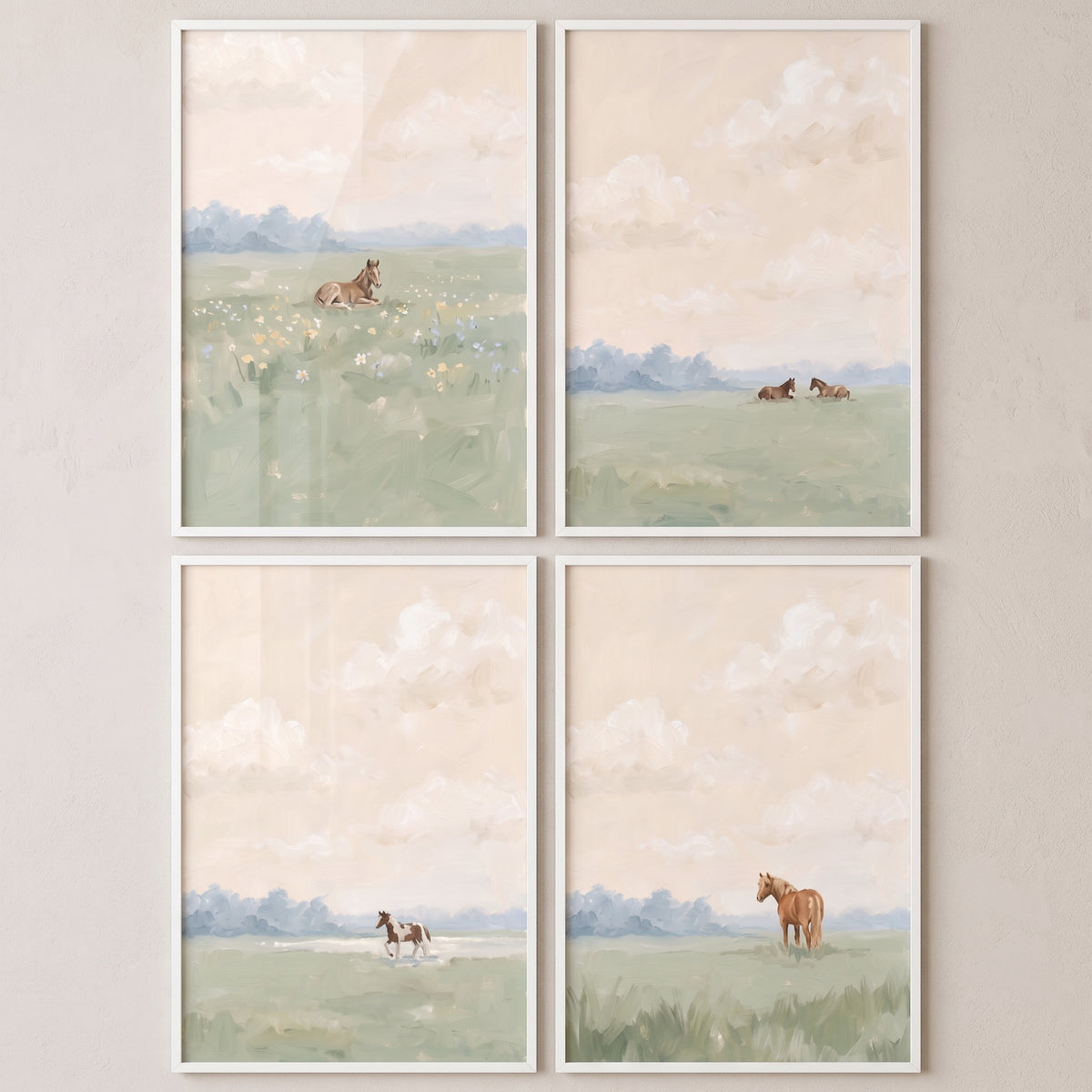 Impressionist rural pasture horse wall art set of 4 features horses in soft fields under cloudy skies in white frames.
