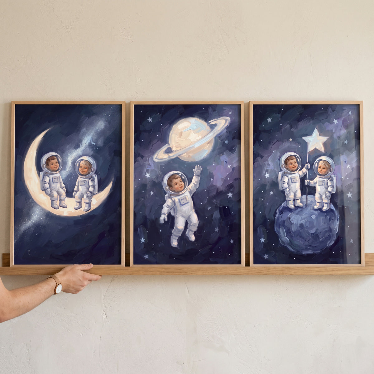 Impressionist starry baby astronaut wall art set of 3 depicts infants in space suits on the moon and planets.