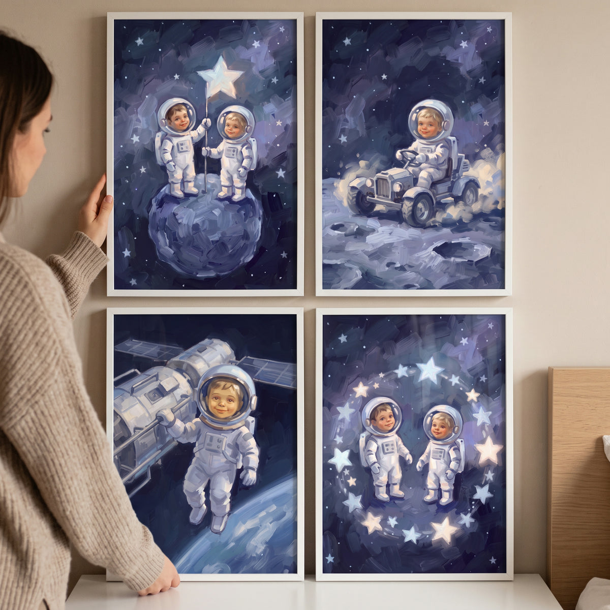 A woman displays an infinite space baby astronaut wall art set of 4 featuring toddlers in spacesuits amidst the stars.