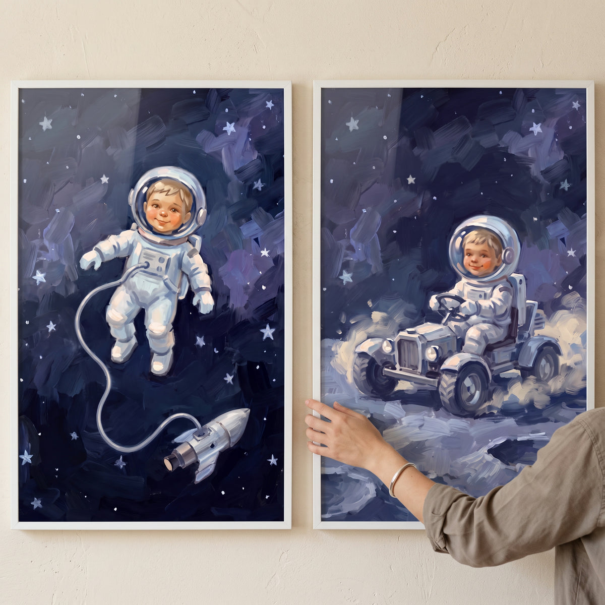 Inky blue baby astronaut wall art set of 2 depicts a baby floating in deep space and driving a rover on the moon.
