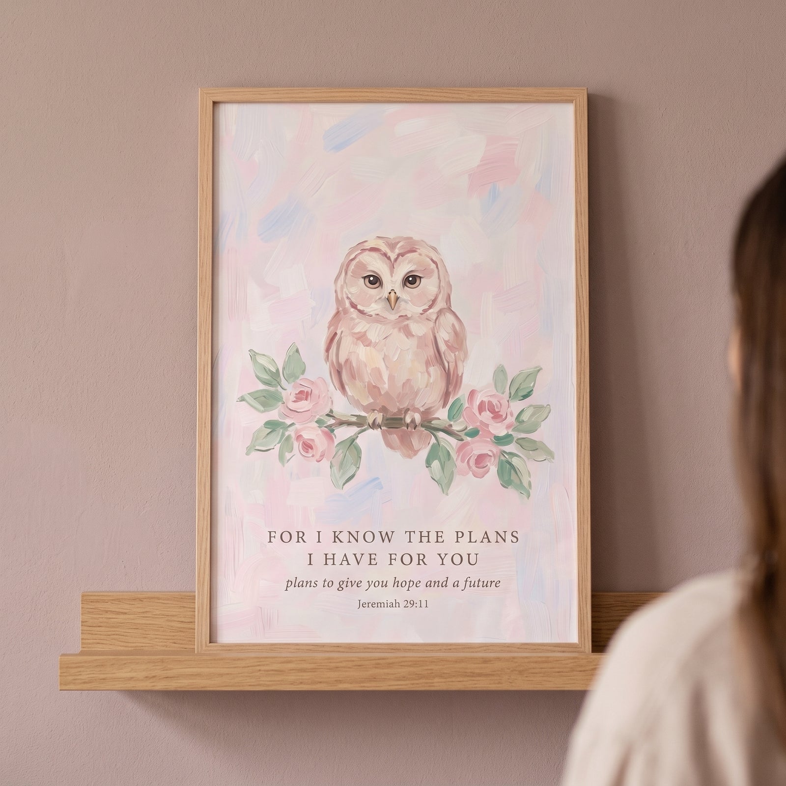Framed jeremiah 29 11 owl bible wall art with a pink watercolor owl on a branch, resting on a wooden shelf.