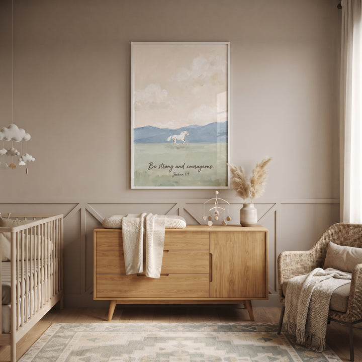 Joshua scripture white horse wall art in a neutral nursery above a wooden dresser near a crib and wicker chair.
