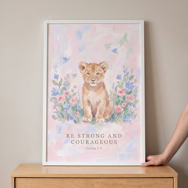 Watercolor lion cub and flowers on joshua verse lion bible wall art with the text Be strong and courageous Joshua 1:9.