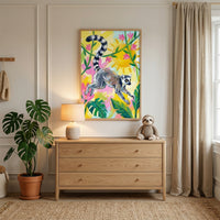 Bright and playful bedroom corner with a wooden dresser topped by a lamp and a plush sloth toy, next to a large leafy houseplant. Above the dresser hangs a colorful painting of a ring tailed lemur mid leap surrounded by pink flowers and green leaves against a sunny yellow background, creating a cheerful jungle inspired focal point.