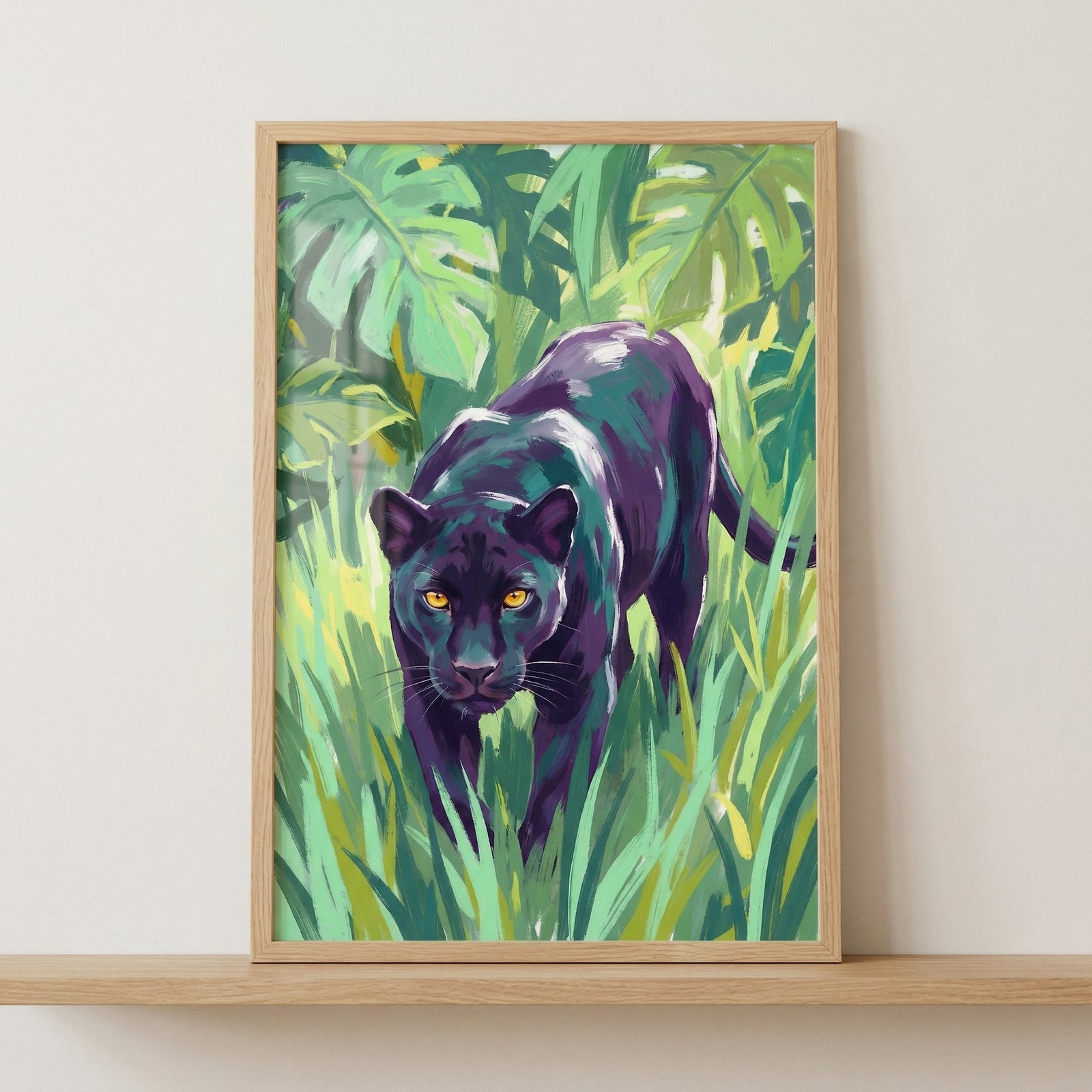 An expressive digital illustration of a black panther prowling through a lush jungle. The large cat features deep purple highlights in its dark fur and piercing yellow eyes. It is surrounded by vibrant green tropical plants and tall grass, depicted with bold, artistic brushwork. The framed artwork is shown resting on a wooden shelf against a plain, light-colored wall.