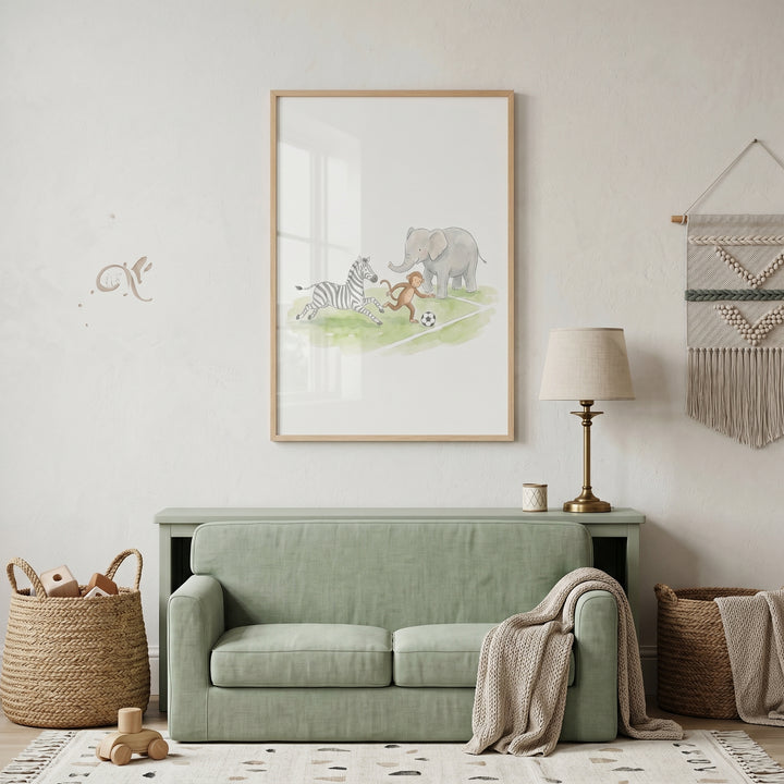 Kicking ball brown animals wall art hangs above a green sofa in a nursery with wicker baskets and neutral decor.