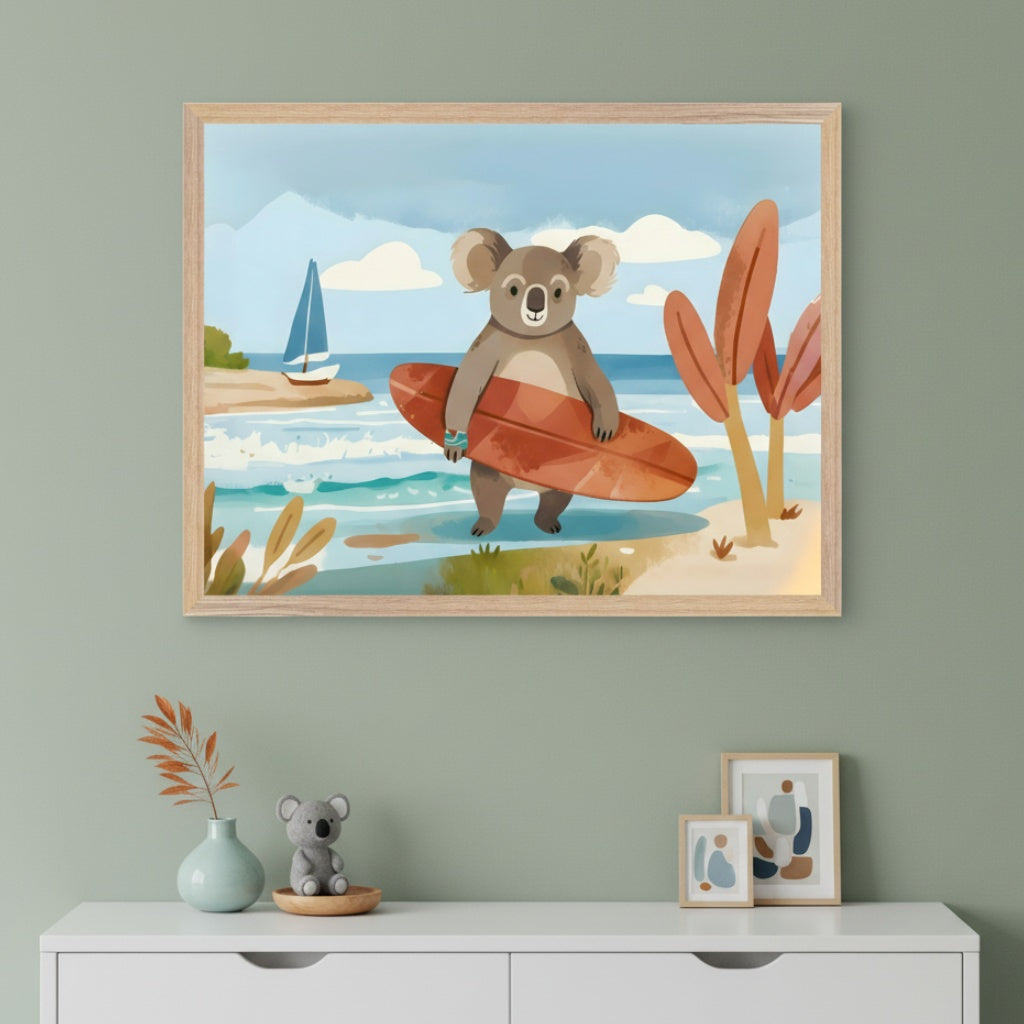 Modern kid's room with a white dresser against a sage green wall. A framed watercolor illustration of a surfing koala on a beach hangs centered above the dresser. On the dresser are a vase, koala toy, and two small framed abstract artworks.