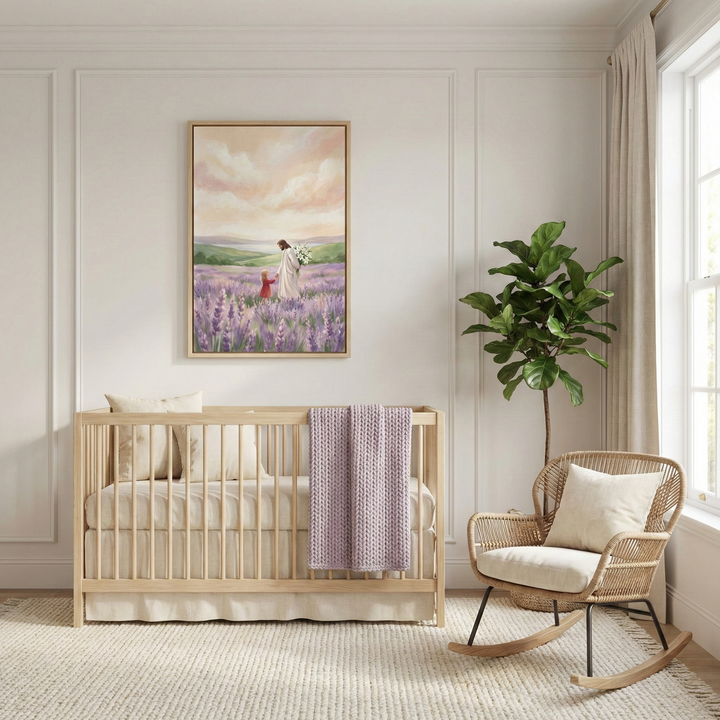 A peaceful, minimalist nursery with light-colored paneled walls. A light wood crib sits against the wall, adorned with a lavender knit blanket. Above it hangs a large framed artwork showing Jesus Christ walking through a field of purple flowers, holding the hand of a small child in a red outfit. To the right is a wicker rocking chair with cream-colored cushions and a tall green potted plant. Soft natural light flows into the room from a nearby window, and a neutral-toned textured rug covers the floor.