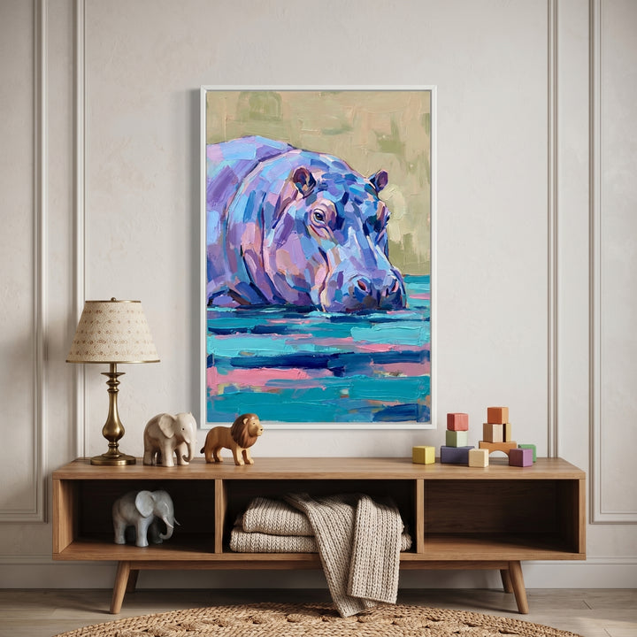 Lavender palette knife hippo wall art hangs above a wooden table with toy animals and blocks in a neutral nursery.