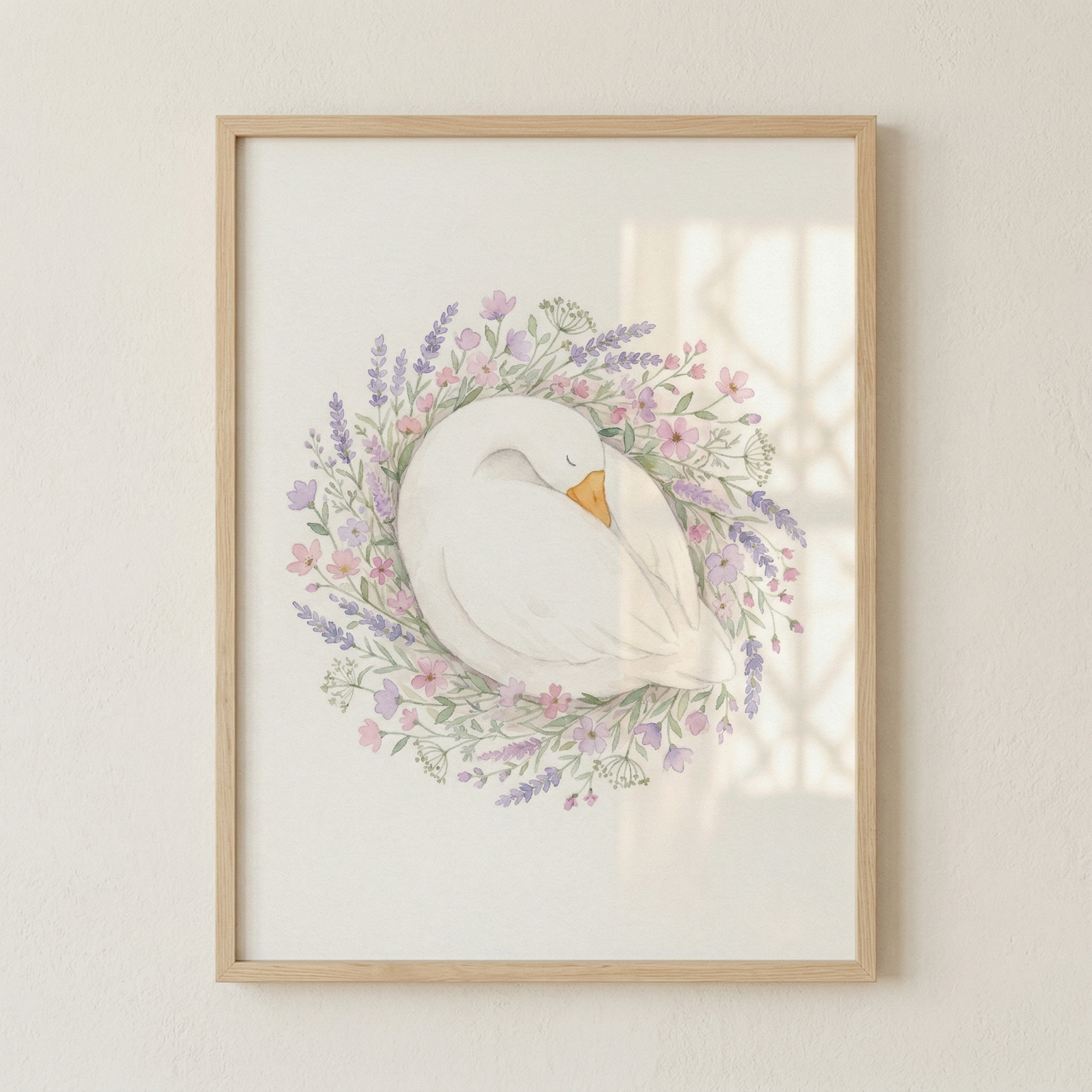 A framed illustration of a serene white goose tucked into a sleeping position. The bird is nestled in the center of a delicate, circular wreath composed of soft-colored wildflowers and greenery. The floral arrangement features tiny blossoms in gentle shades of lavender, pink, and purple, interspersed with fine green leaves and sprigs.
