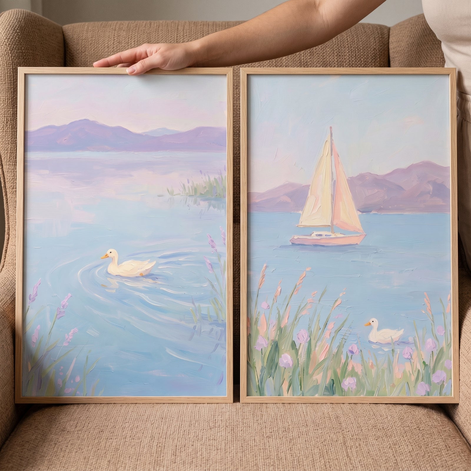 Lilac lake white duck wall art set of 2 featuring a sailboat, distant mountains, and purple flowers by the shore.