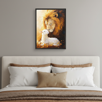 Modern bedroom with a beige upholstered bed. A framed oil painting of a gentle lion and a lamb touching noses, bathed in warm light, hangs centered above the headboard.