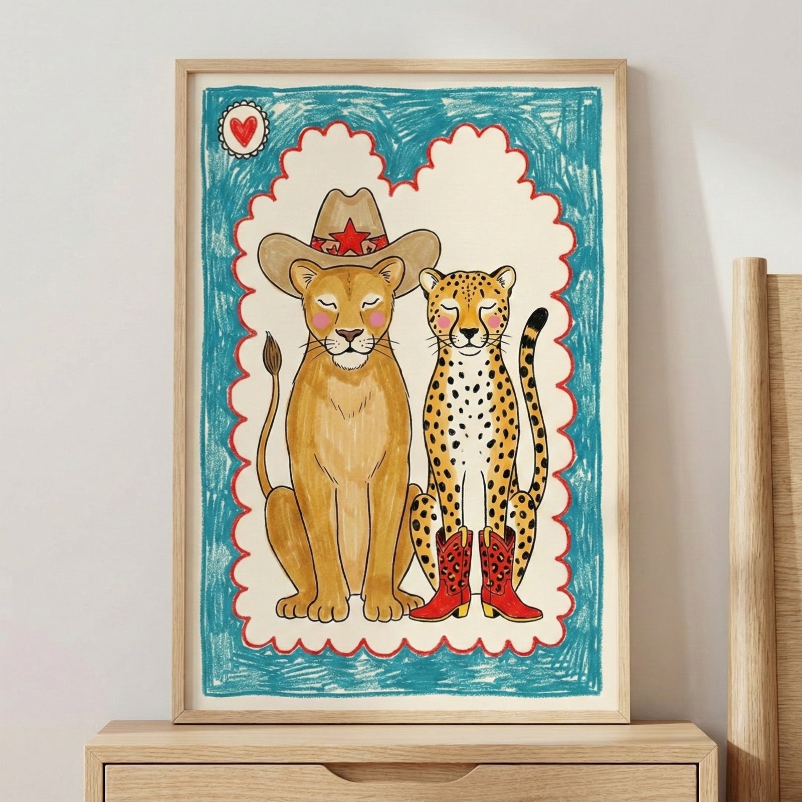 Framed illustration of a lion and a cheetah with closed eyes, both blushing. The lion wears a cowboy hat with a red star, and the cheetah sports red cowboy boots. Crayon-style blue and red scalloped border frames the playful, western-themed animal portrait.