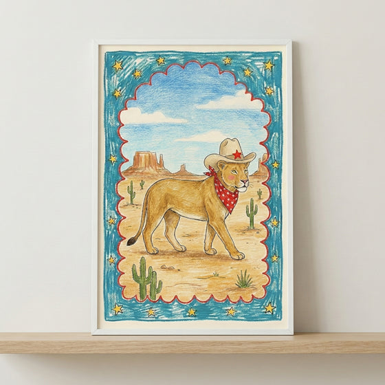 Whimsical illustration of a lion dressed as a cowboy, wearing a red bandana and a tan hat with a red star, walking through a desert landscape with cacti and mesas under a blue sky. The scene is framed with a scalloped blue border decorated with yellow stars.