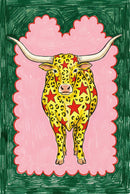Bold and whimsical illustration of a longhorn cow with yellow, leopard-like spots and large red stars covering its body. The cow stands against a scalloped pink background with a deep green border, blending pop art and folk art styles.